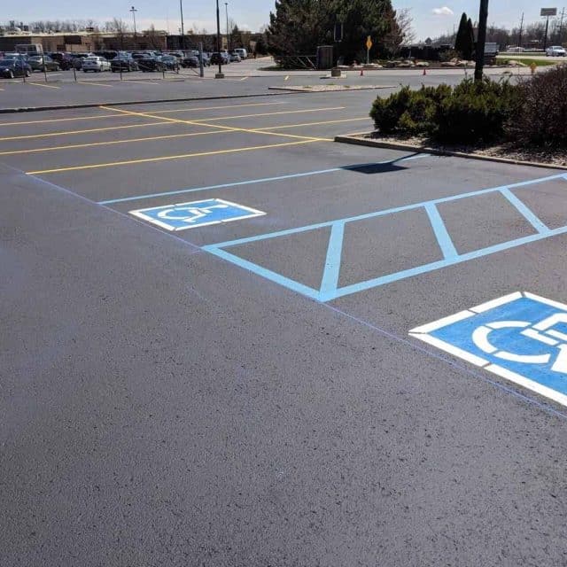 Blog: An empty lot with designated accessible parking spaces.